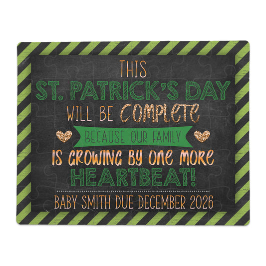 St. Patrick’s Day pregnancy announcement puzzle with black chalkboard-style design and green striped border, reading “This St. Patrick’s Day Will Be Complete Because Our Family Is Growing by One More Heartbeat! Baby Smith Due December 2026”