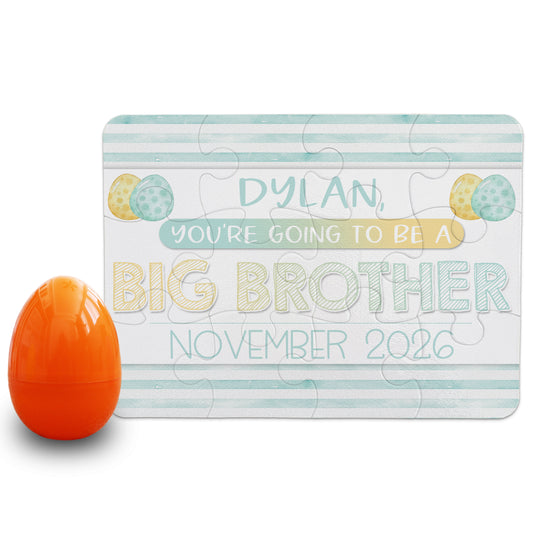 Personalized big brother pregnancy announcement puzzle reading “Dylan, you’re going to be a big brother, November 2026” with pastel Easter egg design and orange egg prop