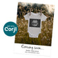 A white baby onesie with a sonogram image hangs on a clothesline in a field of flowers. Text below reads "Coming soon... Baby Walker, Due November 2025.